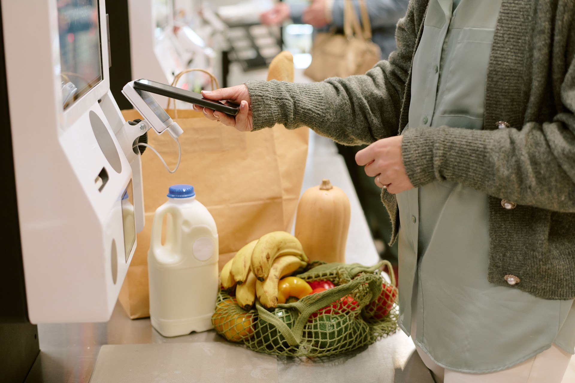 Using Self-Checkout Machine at Grocery Store